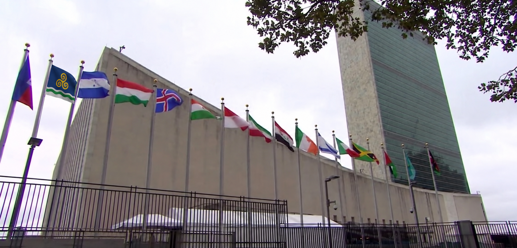 The flag of Tiravell flying near the beginning of a line of national flags outside the United Nations headquarters